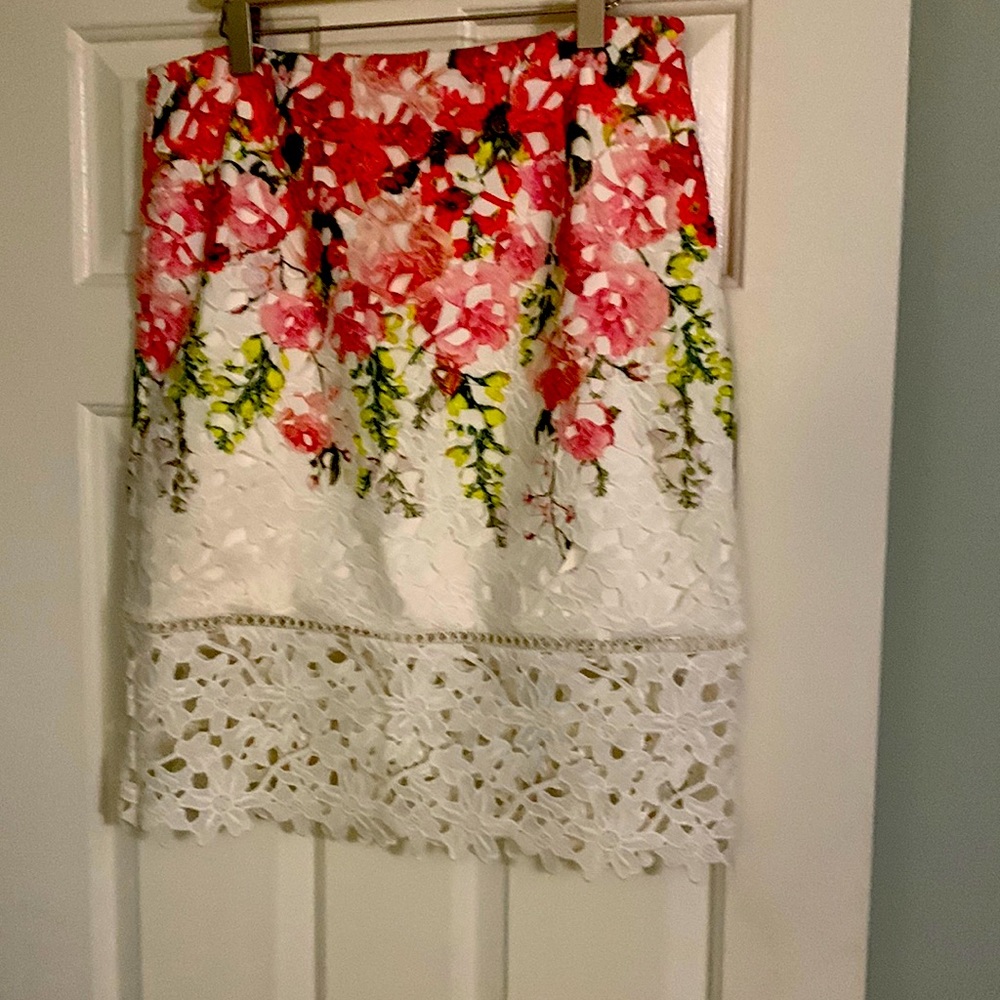 Knee length skirt with lace overlay. Size 12.  23 inches from waist to hem